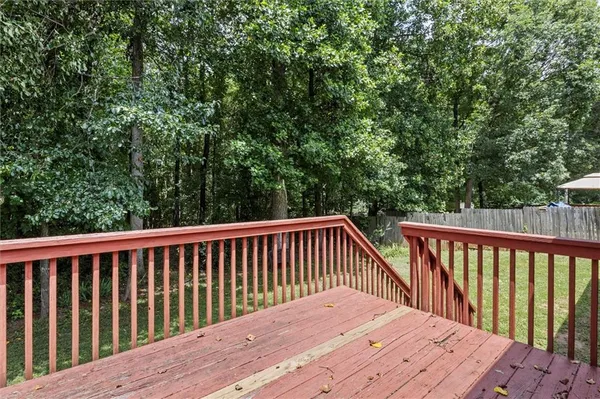 a balcony with wooden floor