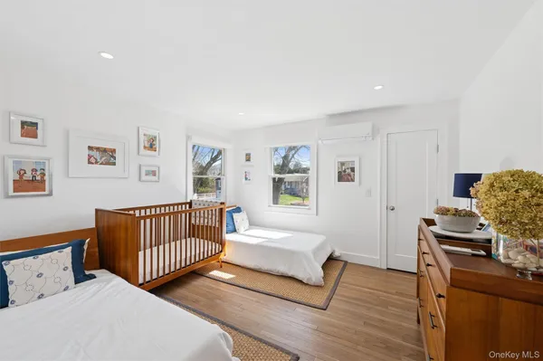 a bedroom with furniture and a window