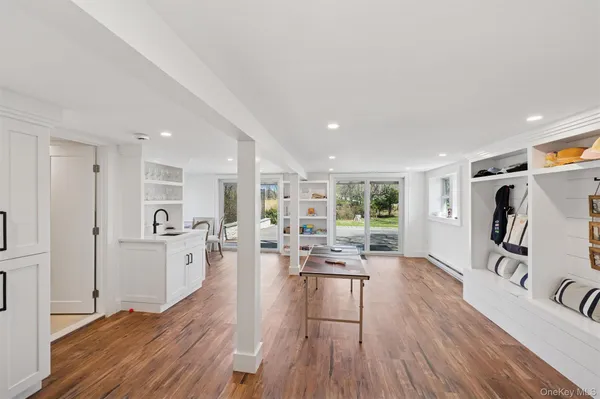 a living room with furniture window and wooden floor