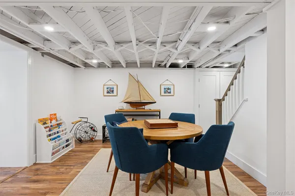 a outdoor dining room with furniture and wooden floor