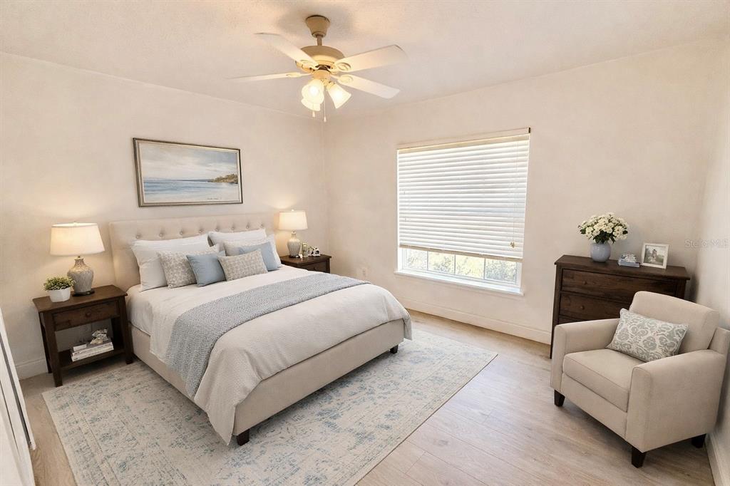 1220 Myrtle Avenue St. Cloud, FL 34771 - Photo 15 of 59 a bedroom with a bed couches and a window