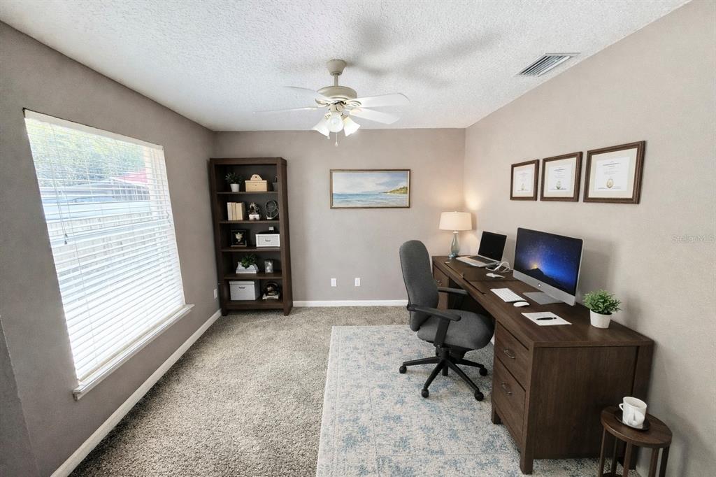 1220 Myrtle Avenue St. Cloud, FL 34771 - Photo 18 of 59 a workspace with furniture and a window
