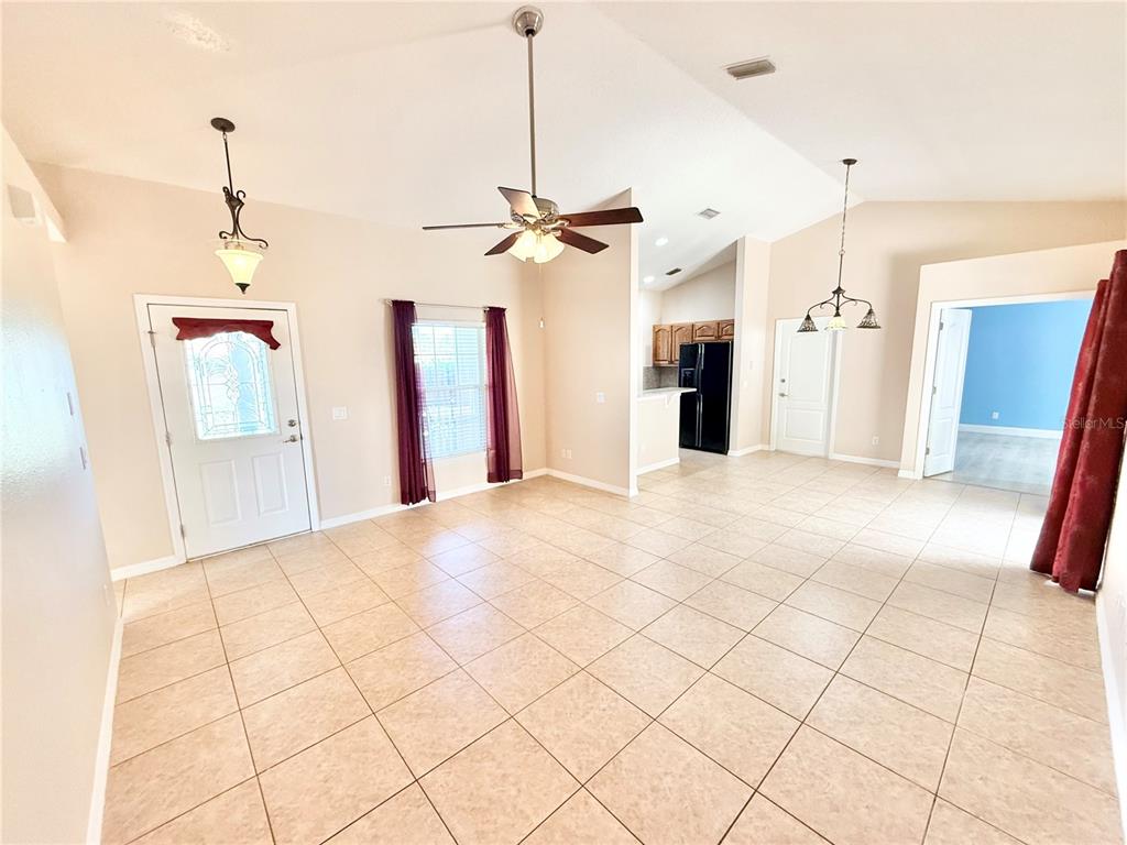 1220 Myrtle Avenue St. Cloud, FL 34771 - Photo 19 of 59 a view of a kitchen with cabinet and a chandelier fan