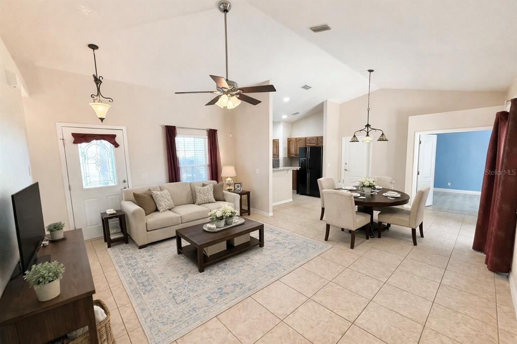 1220 Myrtle Avenue St. Cloud, FL 34771 - Photo 20 of 59 a living room with furniture a flat screen tv and a window