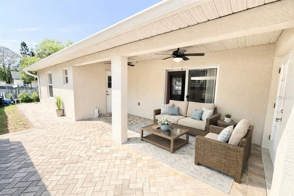 1220 Myrtle Avenue St. Cloud, FL 34771 - Photo 26 of 59 a view of a patio with couches and potted plants