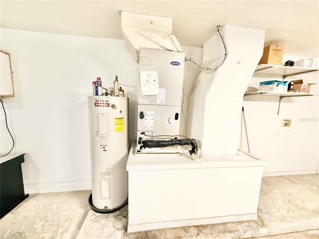 1220 Myrtle Avenue St. Cloud, FL 34771 - Photo 31 of 59 a utility room with dryer and washer