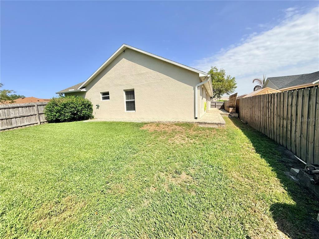 1220 Myrtle Avenue St. Cloud, FL 34771 - Photo 33 of 59 a view of a house with a yard