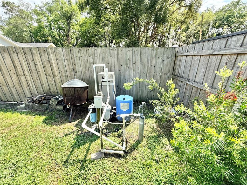 1220 Myrtle Avenue St. Cloud, FL 34771 - Photo 34 of 59 a view of backyard with a table and chairs