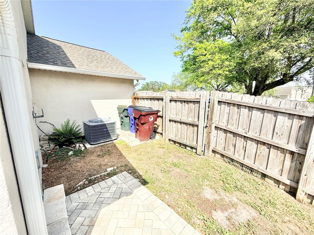 1220 Myrtle Avenue St. Cloud, FL 34771 - Photo 35 of 59 a backyard of a house with seating space