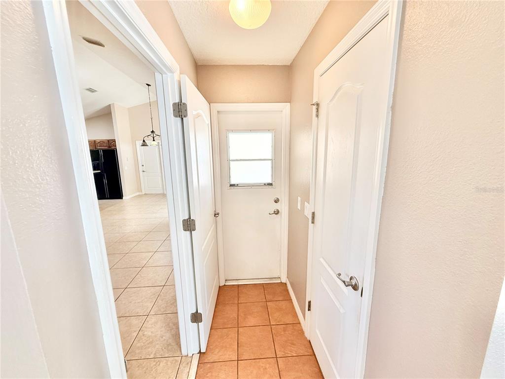 1220 Myrtle Avenue St. Cloud, FL 34771 - Photo 40 of 59 a view of a bathroom from a hallway