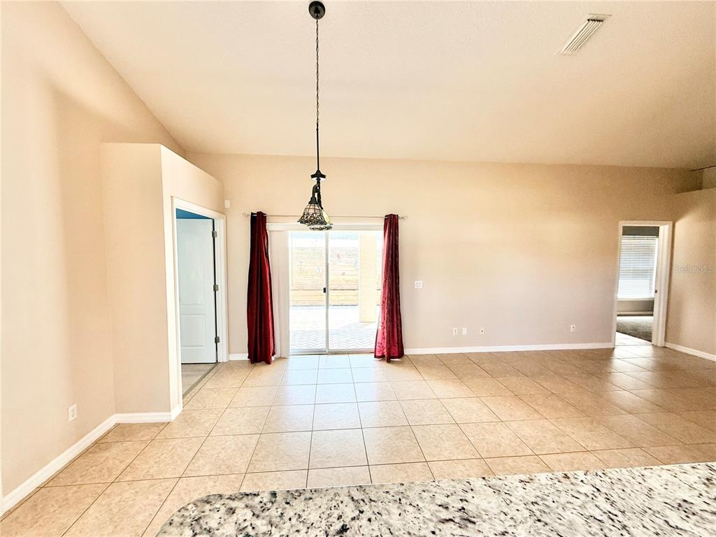 1220 Myrtle Avenue St. Cloud, FL 34771 - Photo 42 of 59 a view of a hallway with a yellow space