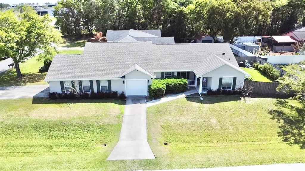 1220 Myrtle Avenue St. Cloud, FL 34771 - Photo 48 of 59 a aerial view of a house with swimming pool