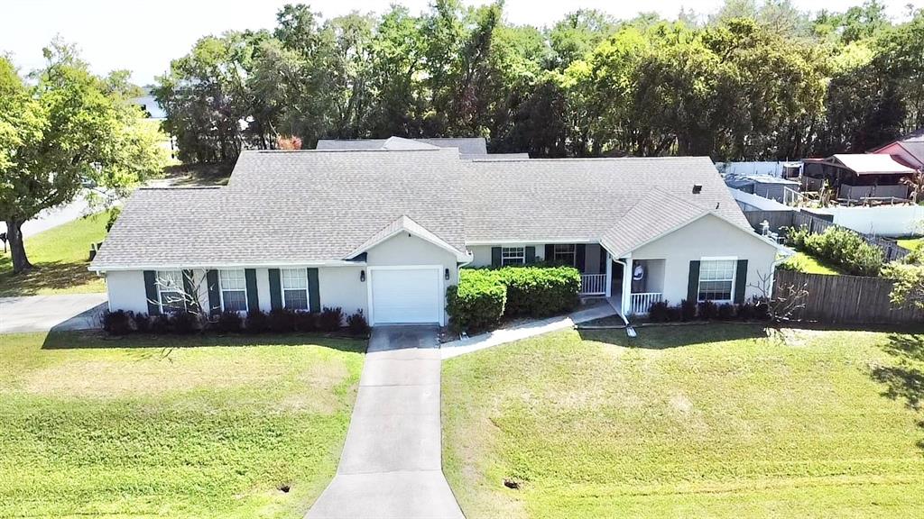 1220 Myrtle Avenue St. Cloud, FL 34771 - Photo 50 of 59 a view of a house with swimming pool and sitting area