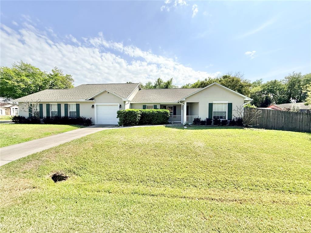 1220 Myrtle Avenue St. Cloud, FL 34771 - Photo 51 of 59 a front view of a house with swimming pool