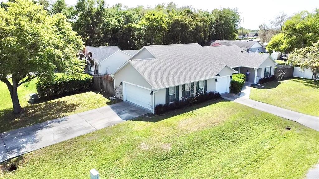 1220 Myrtle Avenue St. Cloud, FL 34771 - Photo 52 of 59 a view of a house with pool and chairs