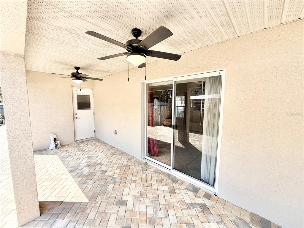 1220 Myrtle Avenue St. Cloud, FL 34771 - Photo 54 of 59 a bedroom with a bed and a large window