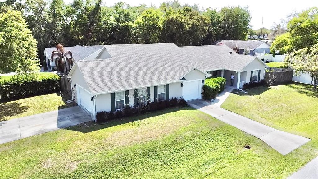 1220 Myrtle Avenue St. Cloud, FL 34771 - Photo 55 of 59 a view of a house with big yard and large tree