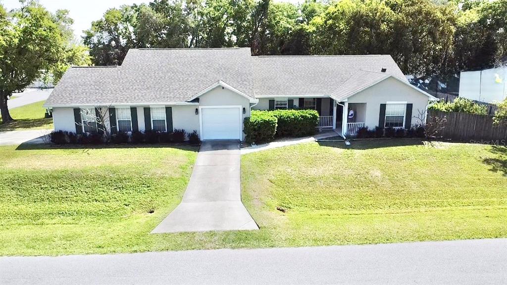 1220 Myrtle Avenue St. Cloud, FL 34771 - Photo 56 of 59 a view of house with swimming pool and a yard