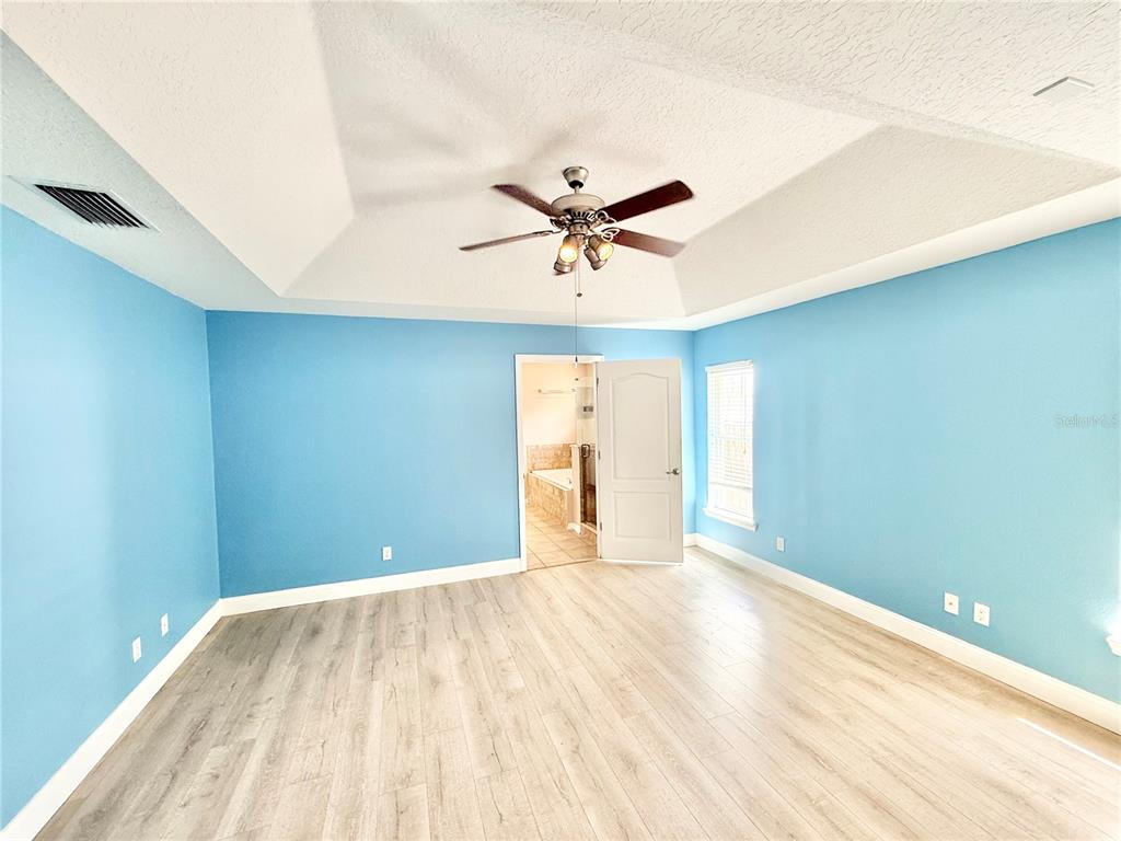 1220 Myrtle Avenue St. Cloud, FL 34771 - Photo 7 of 59 a view of room with a ceiling fan and window