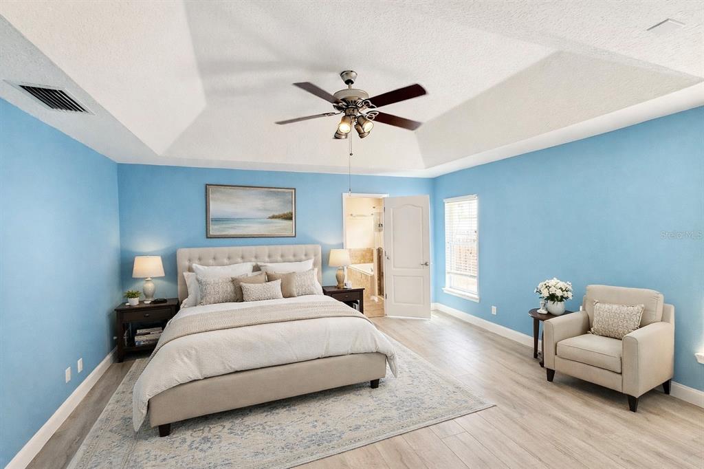 1220 Myrtle Avenue St. Cloud, FL 34771 - Photo 8 of 59 a bedroom with a bed and couch