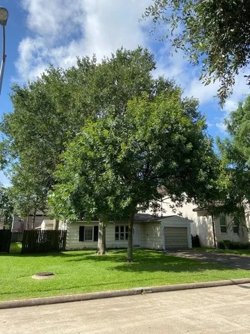 a view of a house with a garden