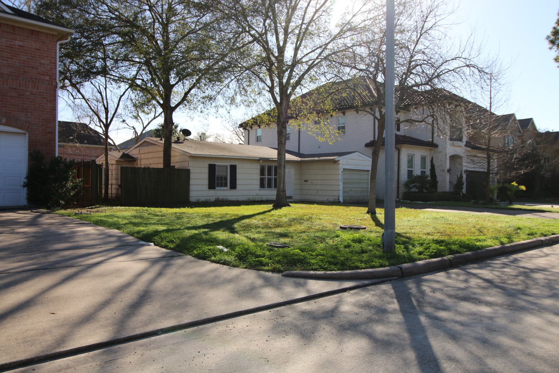 5213 Linden Street Bellaire, TX 77401 - Photo 7 of 18 a view of a house with a backyard