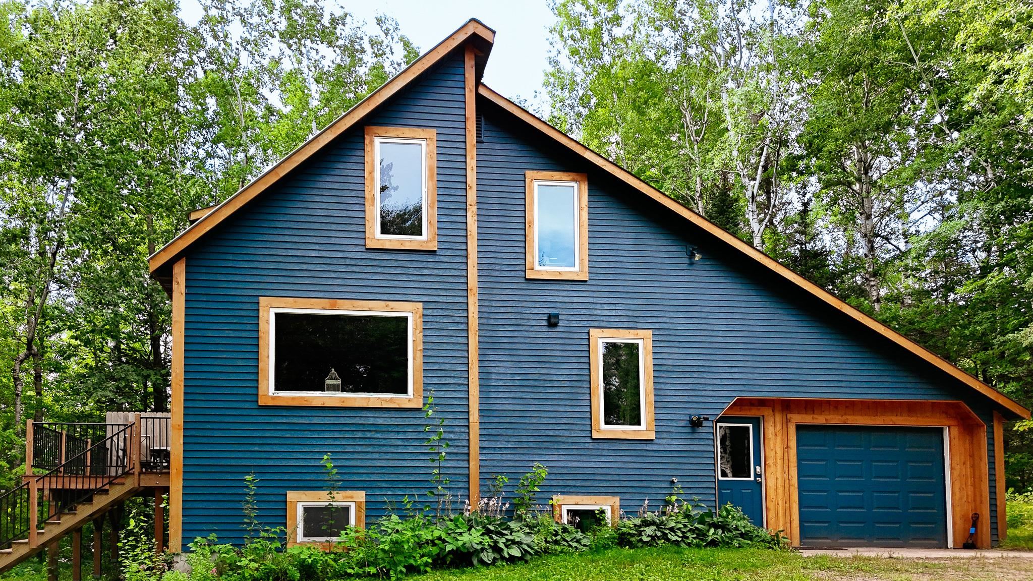 1690 Aho Road Duluth, MN 55804 - Photo 1 of 39 View of side of property with a garage, stairs, and a wooden deck