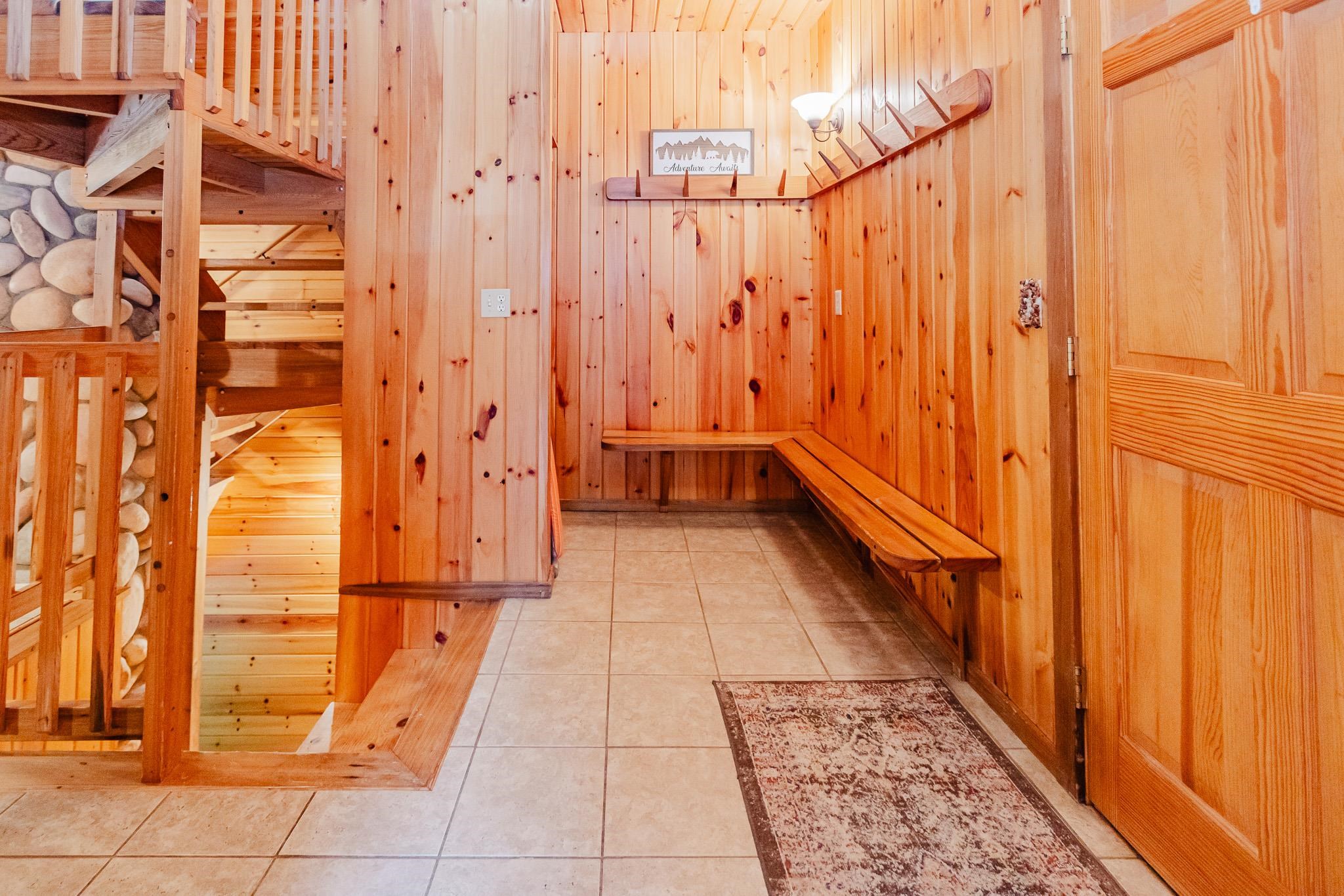 1690 Aho Road Duluth, MN 55804 - Photo 5 of 39 Mudroom with light tile patterned flooring and wood walls