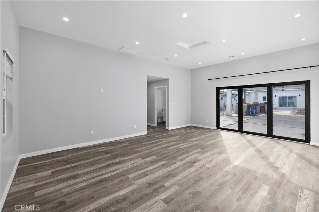 19613 Lanark Street, Unit 1/4 Reseda, CA 91335 - Photo 25 of 38 a view of an empty room with a window