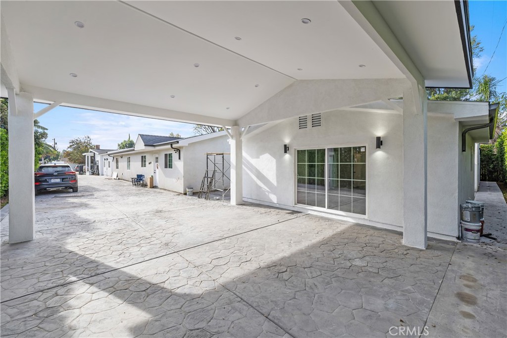 19613 Lanark Street, Unit 1/4 Reseda, CA 91335 - Photo 32 of 38 a view of a porch with furniture and front door