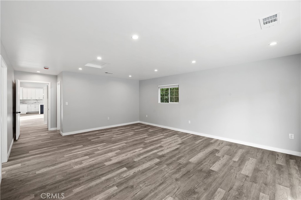 19613 Lanark Street, Unit 1/4 Reseda, CA 91335 - Photo 8 of 38 a view of an empty room and window
