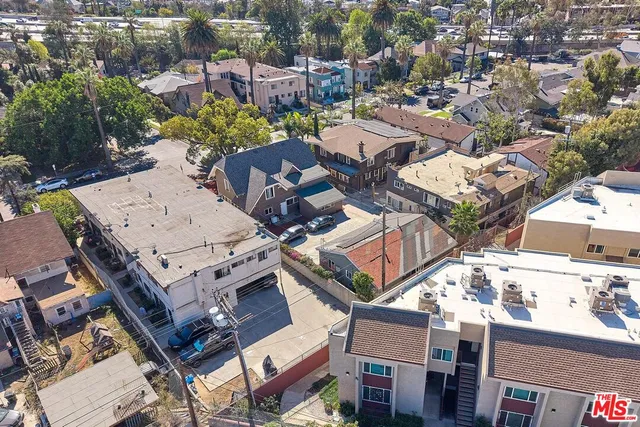 an aerial view of residential building with green space