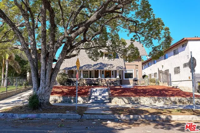 a backyard of a house with yard and outdoor seating
