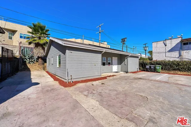 a view of a car park in front of house