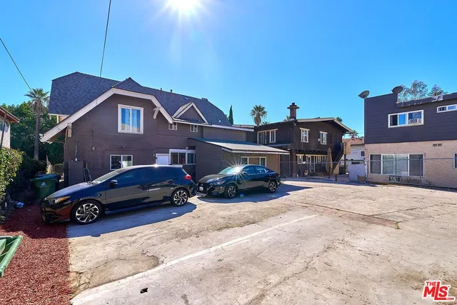a front view of a house with a big yard