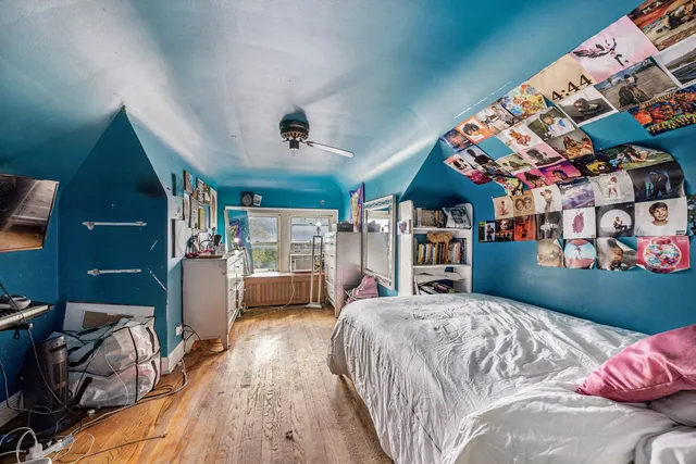 a bedroom with a bed and a walk in closet