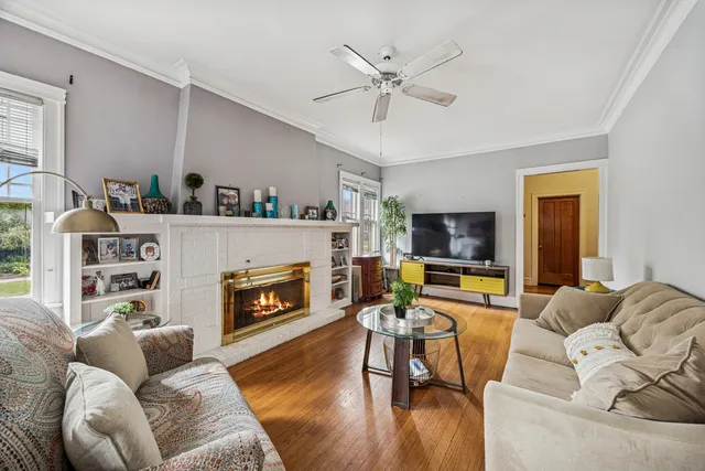 a living room with furniture and a fireplace