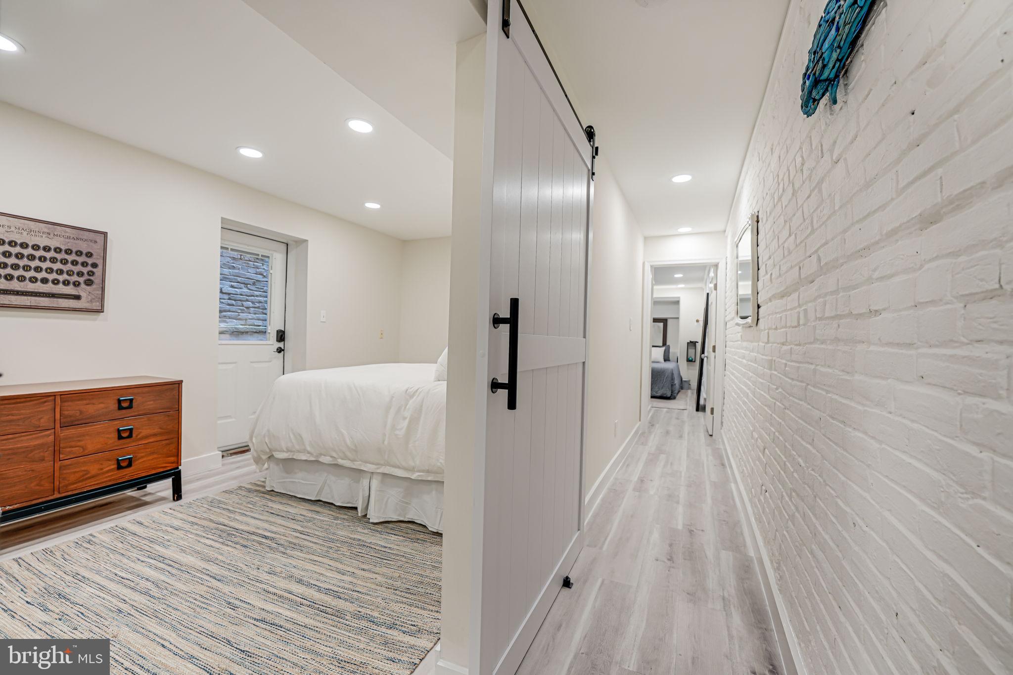 1326 R Street Northwest, Unit 1 Washington, DC 20009 - Photo 18 of 32 a spacious bedroom with a bed and a dresser