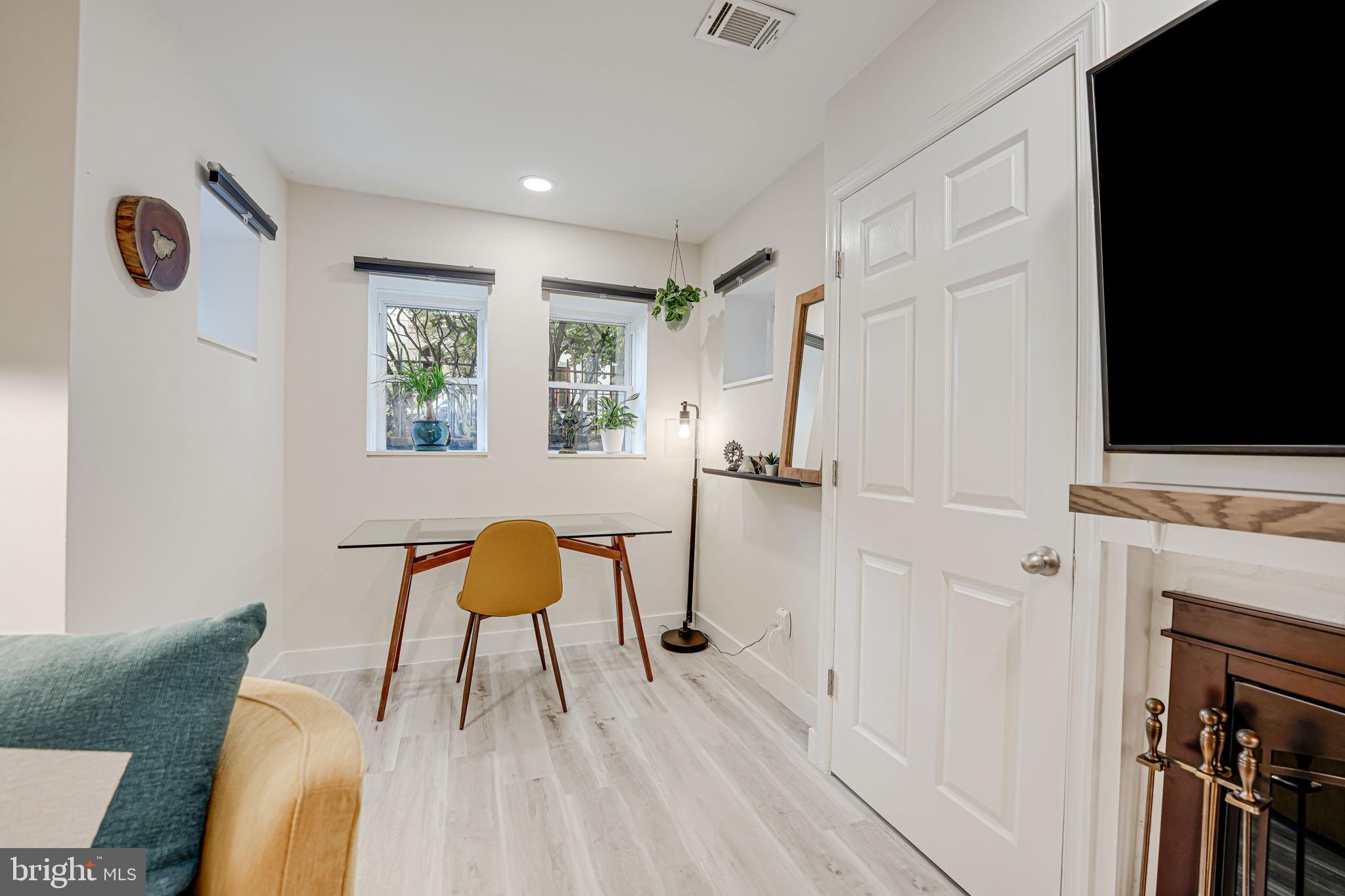 1326 R Street Northwest, Unit 1 Washington, DC 20009 - Photo 5 of 32 a living room with furniture and a window