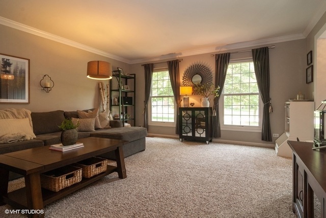 6S235 Cape Road Naperville, IL 60540 - Photo 4 of 19 a living room with furniture and a fireplace
