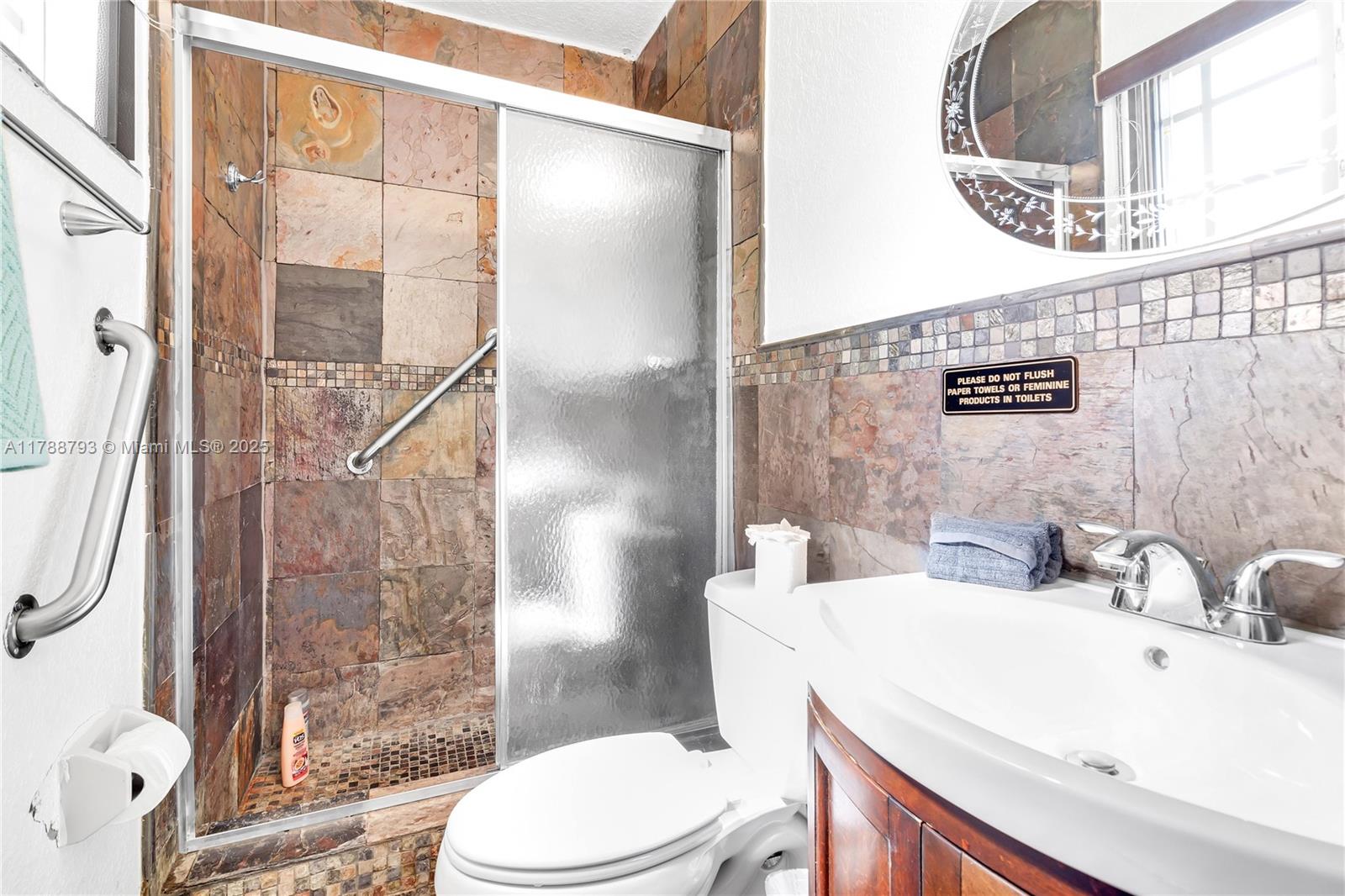 460 Northwest 88th Terrace El Portal, FL 33150 - Photo 13 of 22 a bathroom with a sink toilet and shower