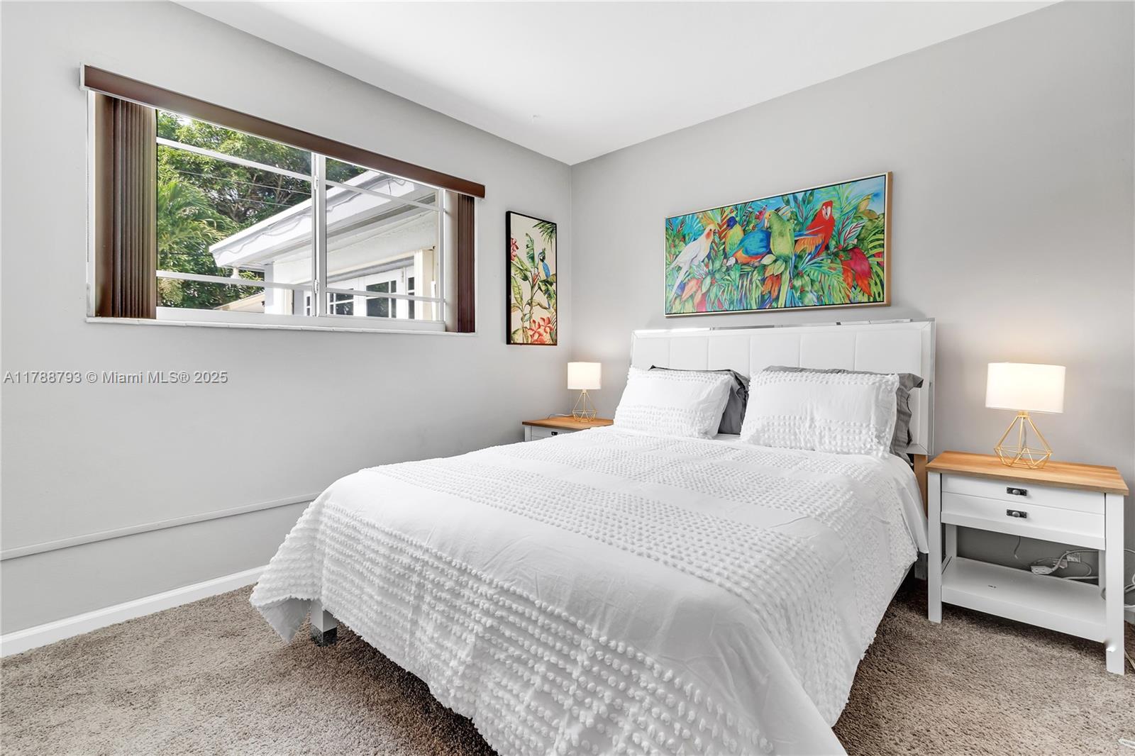 460 Northwest 88th Terrace El Portal, FL 33150 - Photo 14 of 22 a bedroom with a bed and a painting on the wall