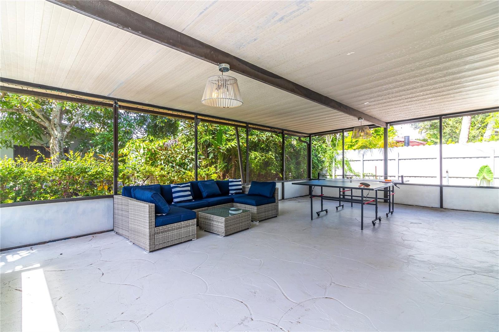 460 Northwest 88th Terrace El Portal, FL 33150 - Photo 20 of 22 a living room with furniture and a large window
