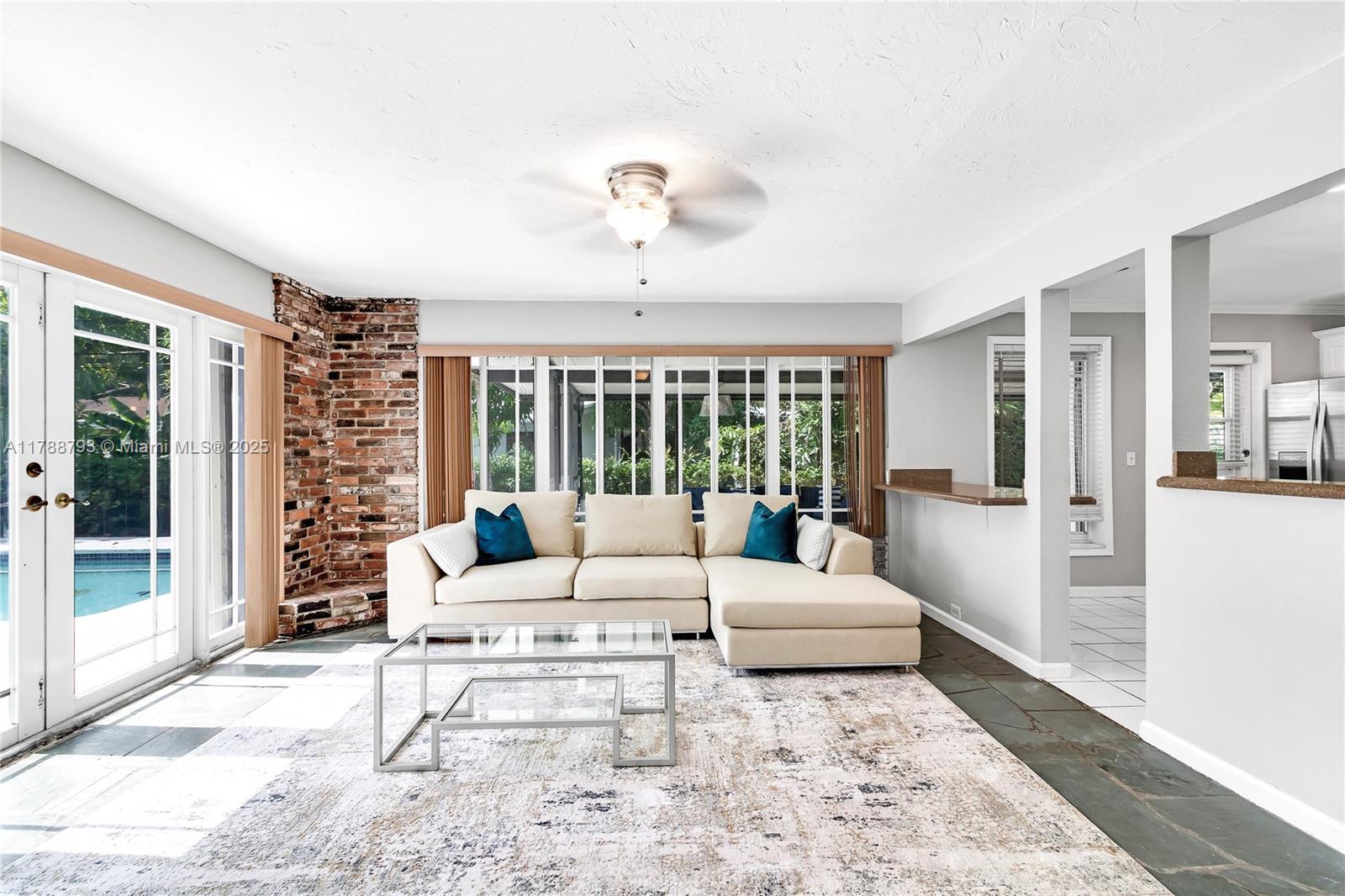 460 Northwest 88th Terrace El Portal, FL 33150 - Photo 7 of 22 a living room with furniture large window and glass door