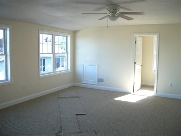 72 Mountford Road Hull, MA 02045 - Photo 16 of 30 an empty room with windows and fan