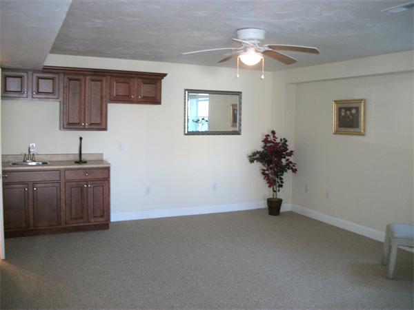 72 Mountford Road Hull, MA 02045 - Photo 20 of 30 a view of a room with a sink a mirror and a fan