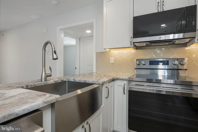 a kitchen with a stove and a sink