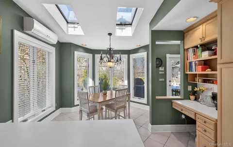 a workspace with furniture and a window