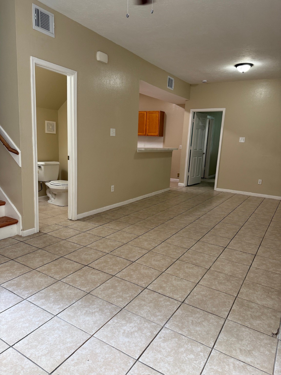 5907 Allison Road Houston, TX 77048 - Photo 3 of 11 an empty room with windows and entrance
