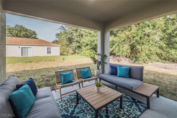 a balcony with furniture and a outdoor view
